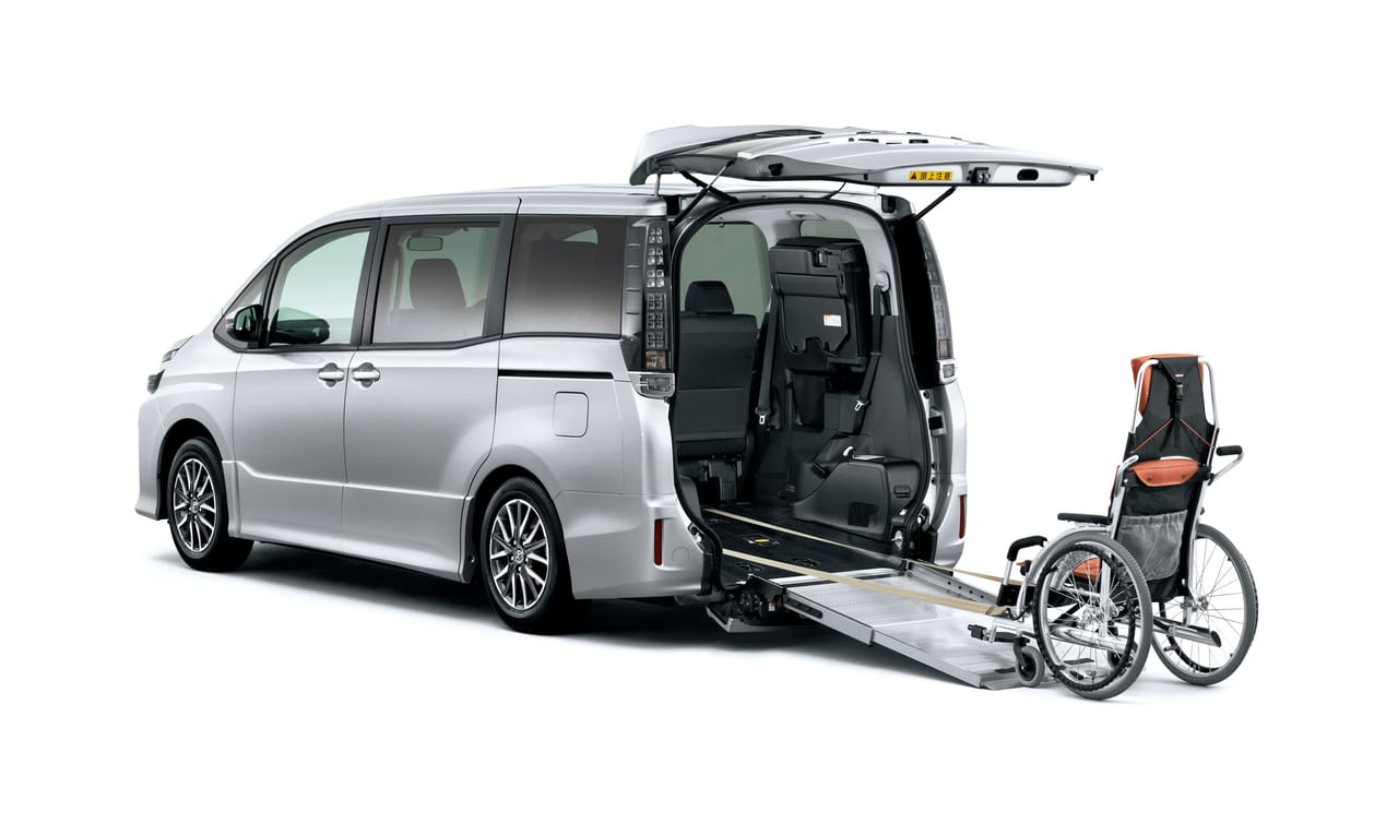 Toyota Noah Welcab rear ramp deployed with a wheelchair positioned at the base, ready to load